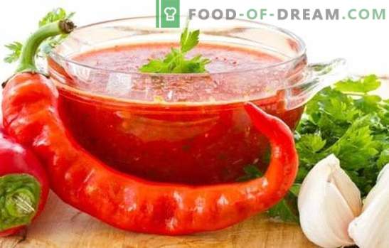 Adjika za paradižnike in česen za zimo: vroča tema domačih pripravkov. 7 najboljših adzhika receptov iz paradižnika in česna za zimo